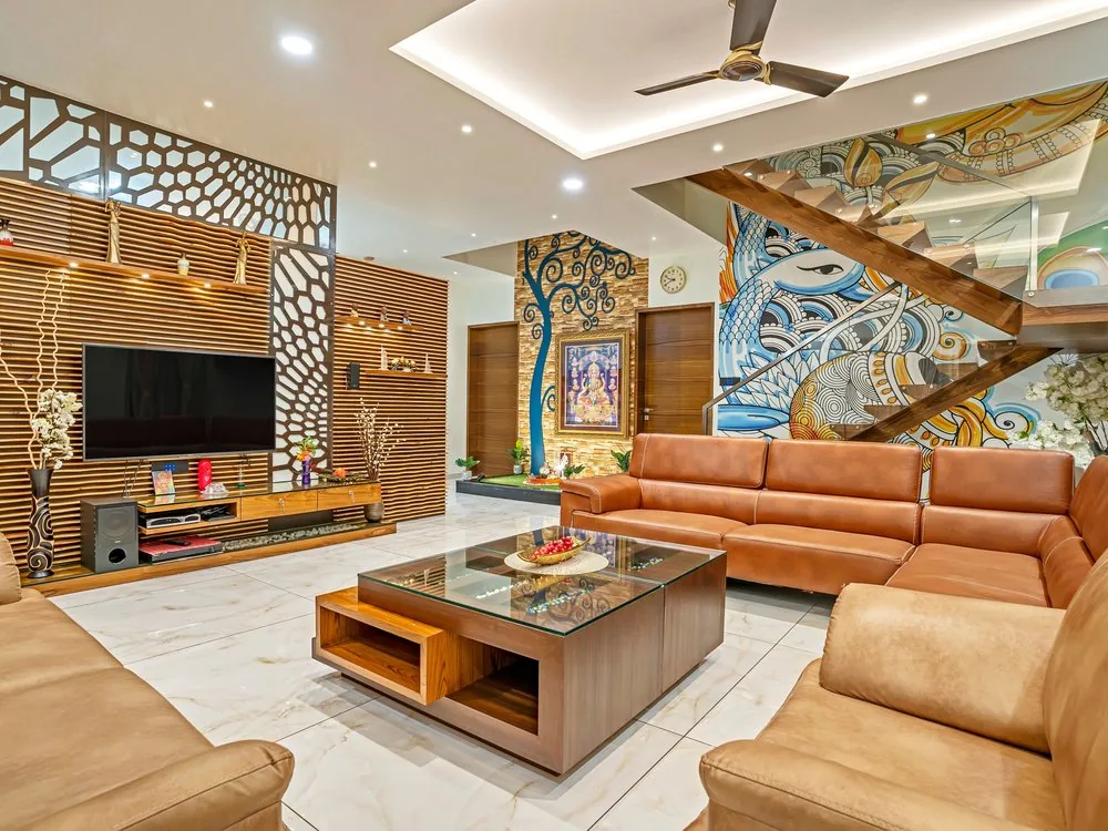 4 BHK living room with fluted wood panelling, leather seating and marble flooring, designed by Dearc Studio in Bangalore