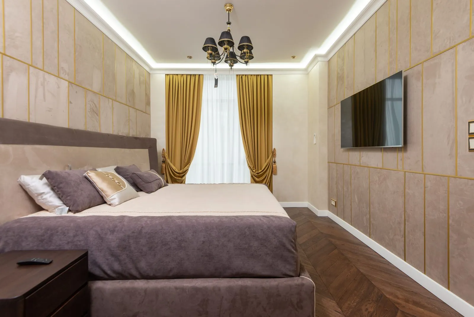 Master bedroom with panelled walls and cove lighting - bedroom interior design