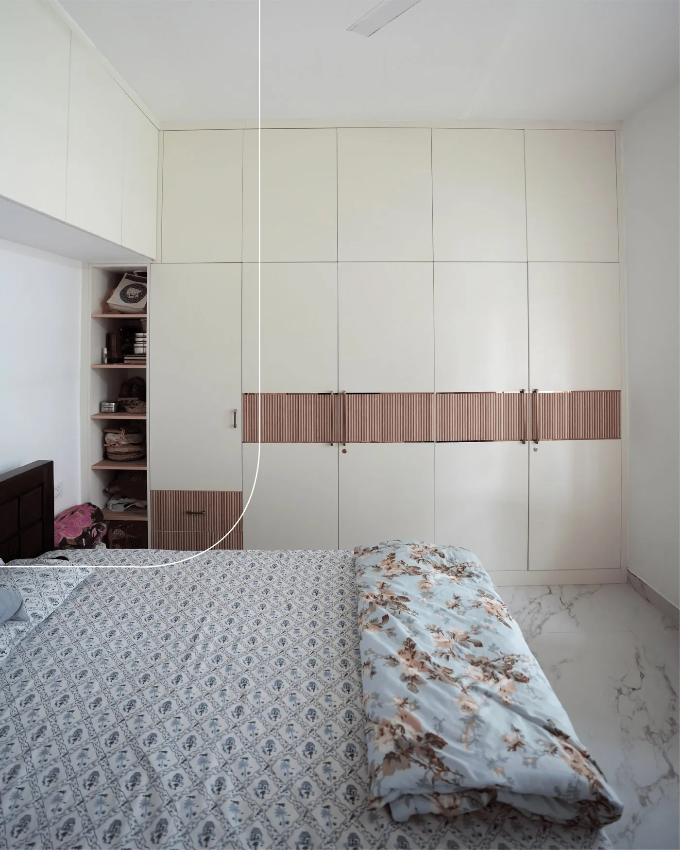 Adit's House bedroom wardrobe with fluted rose-gold accent band