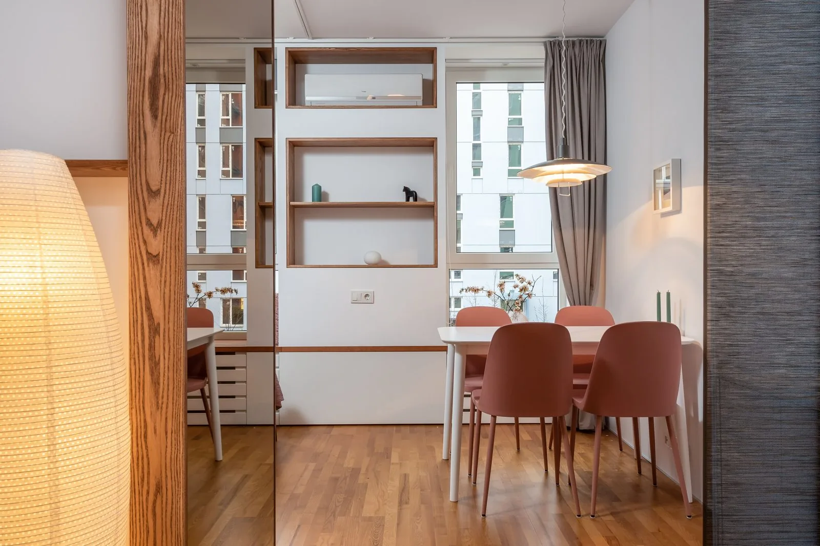 Dining area with display shelving and pendant light - living and dining interiors
