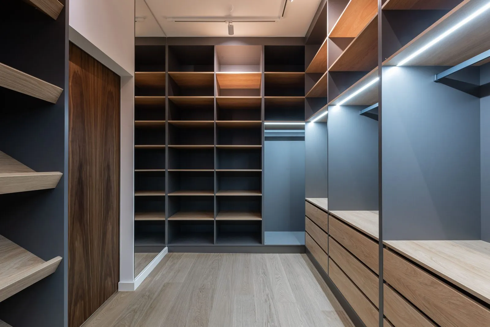 Walk-in wardrobe with open shelving and integrated lighting - custom wardrobe design in Bangalore